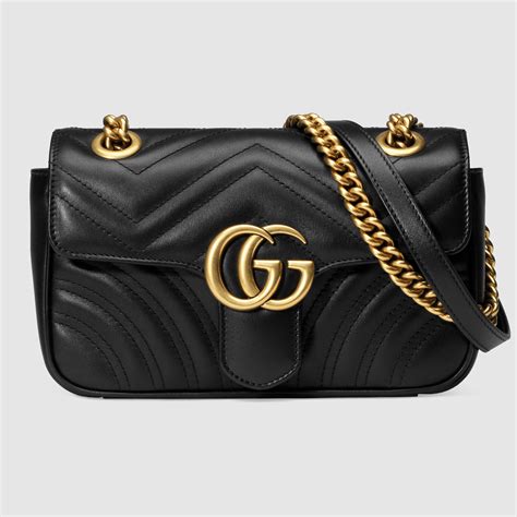 GG Emblem mini bucket bag in black leather 